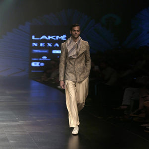 Front overlap cotton khadi bandgala with concealed metal zipper fastening. Short length cotton khadi jacket is embellished with abstract distressed print.   abhisheksharma , abhishekstudio