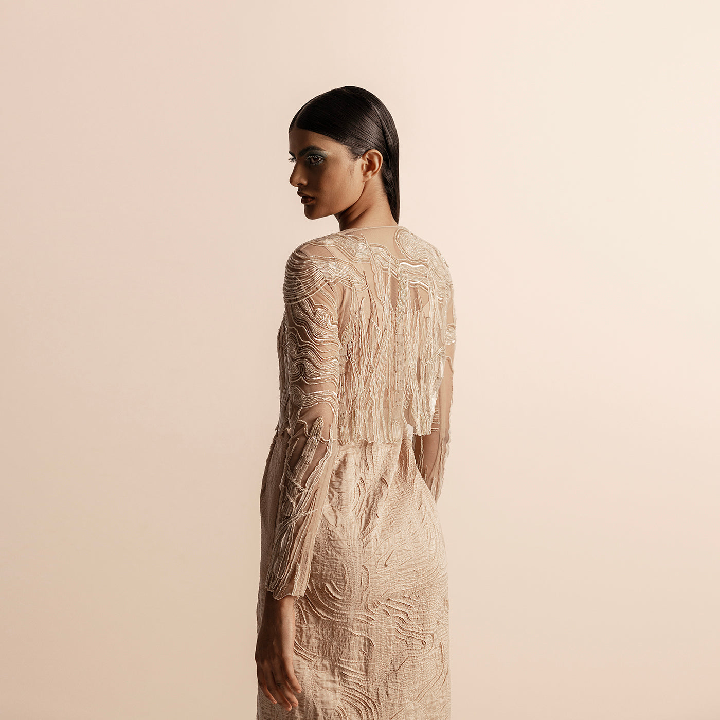 Detailed view of sheer 3D embellished top with quilted texture and long sleeves – 3D embroidery, quilted couture,  modern formalwear