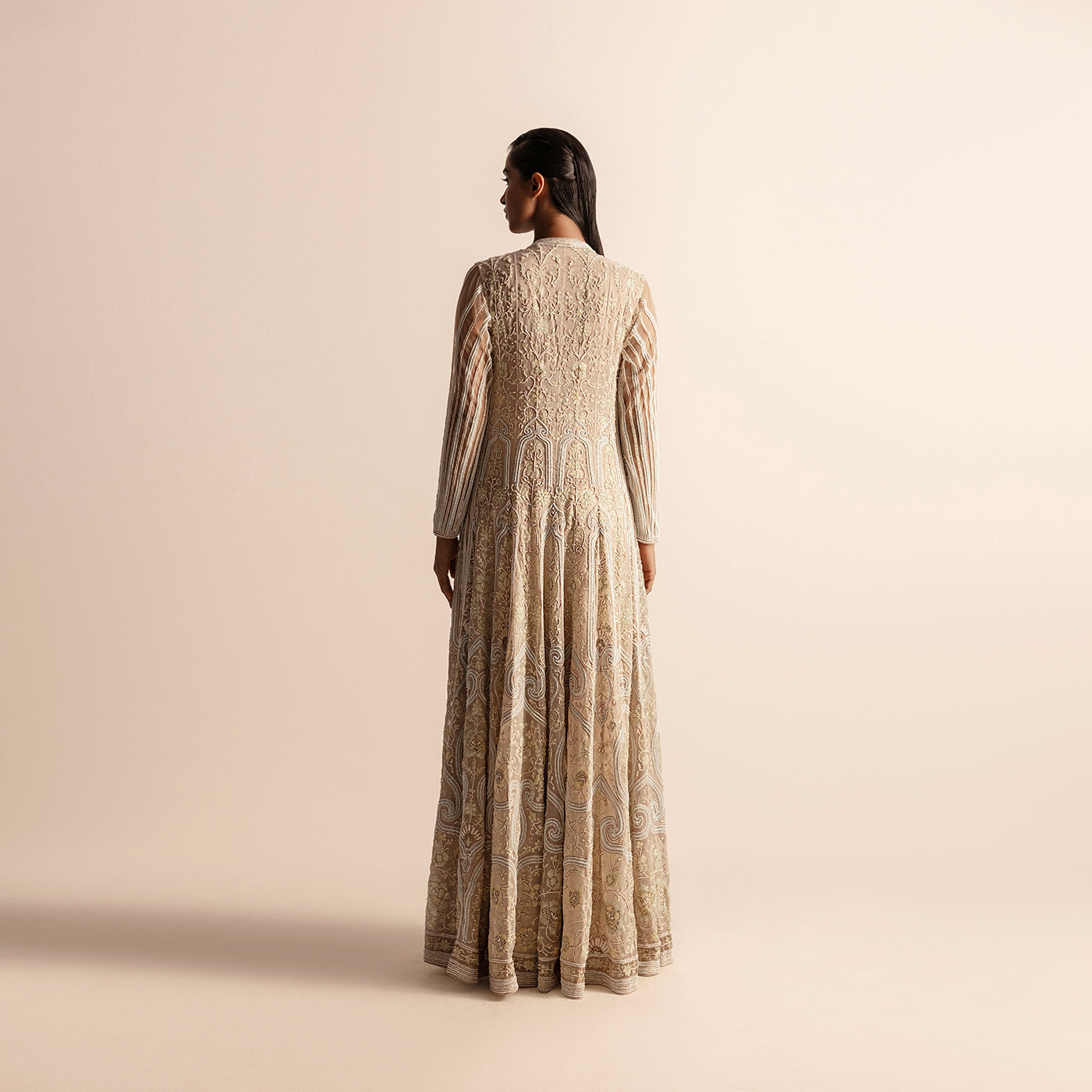 back view of Women's Kalidar jacket with full back embroidery in champagne tones and flared floor-length hem -  flared festive coat, couture outerwear