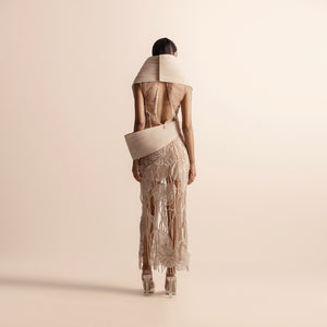Back view of sculpted pleated top and 3D embellished skirt set – sculpted top back, 3D embellished skirt, futuristic fashion,, 