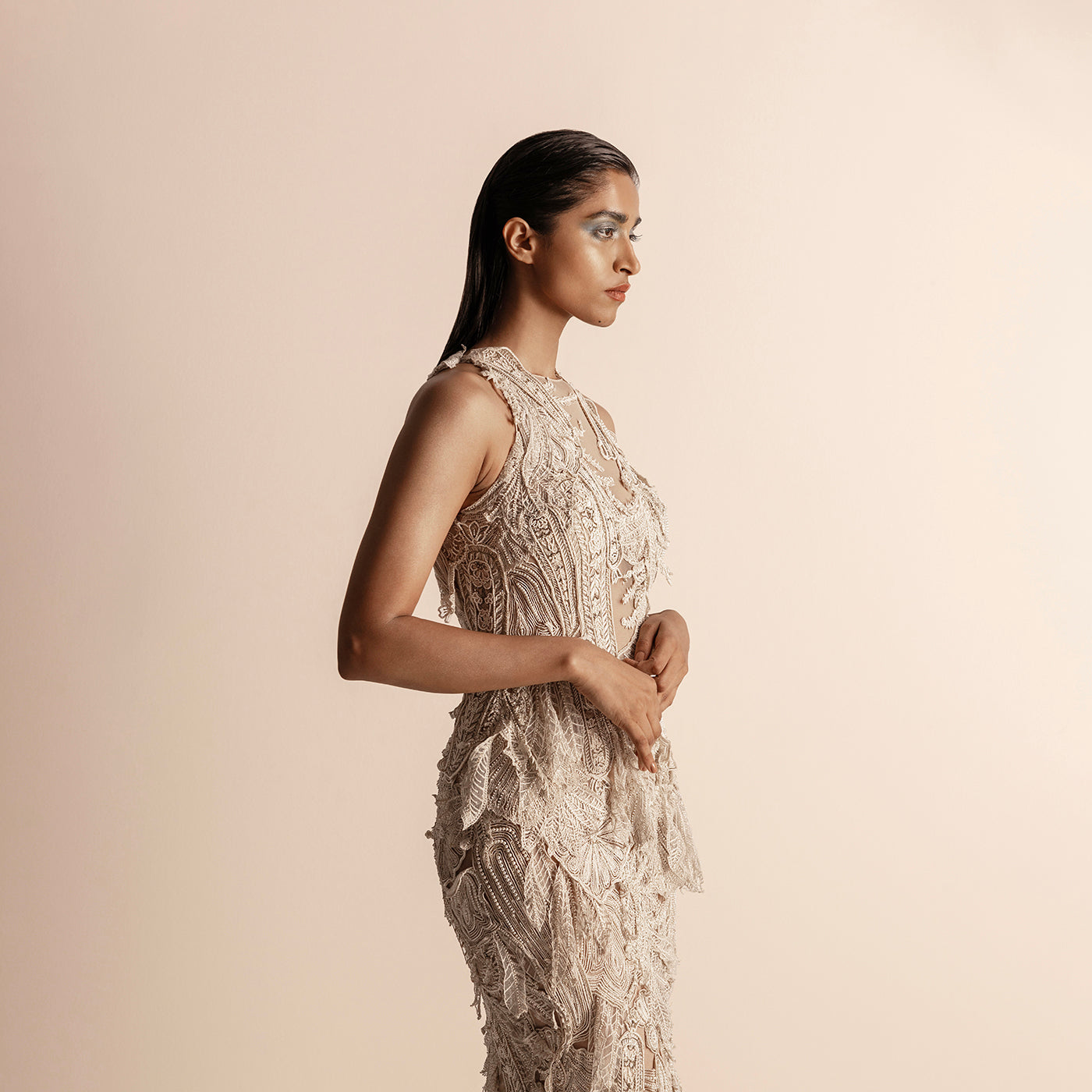 side view of Women's 3D embellished Vana pearl gown with leaf-textured embroidery and illusion neckline - leaf embroidery, illusion neckline, reception couture