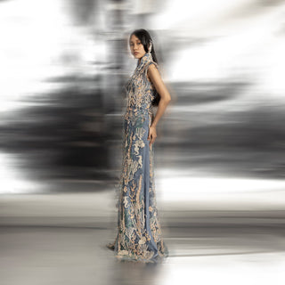 side view of Women's side profile of sleeveless high neck floor-length jacket with reef-inspired 3D embroidery – couture outerwear