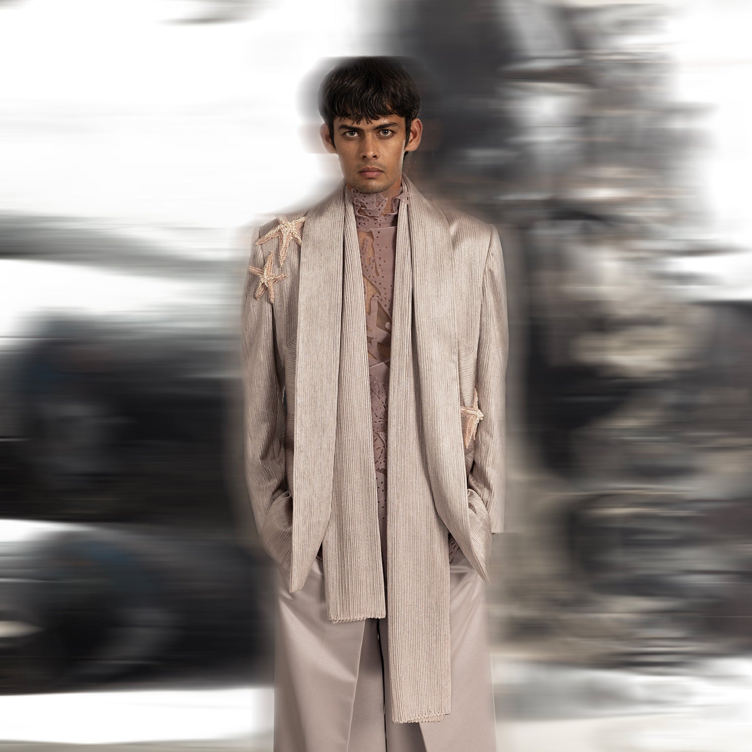 Shallow water extended shawl collar jacket in a graphic yarn couching embellishment. The jacket is teamed up with a 3d laser cut t-shirt and pleated loose wide trousers.  #abhisheksharma #fashiondesignerabhisheksharma #reef #redcarpet #shortdress #abhishekstudio #lfw #fdci 