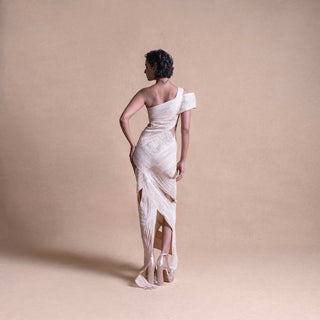Back view of asymmetrical cream dress with layered wrap panels and cutout details – creative fashion design, fitted dress, resort wear