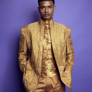 Model wearing gold metallic Bandhgala blazer and matching pants set - Tuxedo, retro suit, menswear