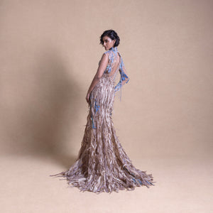 back view of model in earth-toned couture gown with blue embroidered details and open back - eco-luxury fashion, reception gown, backless evening gown,