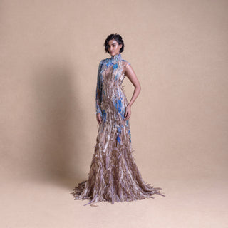 Model in sustainable high-fashion gown with blue floral detailing on beige backdrop - eco-luxury fashion, reception gown
