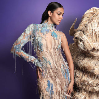 Model posing in nature-inspired sheer couture gown - sustainable designer dress. eco-luxury fashion, reception gown
