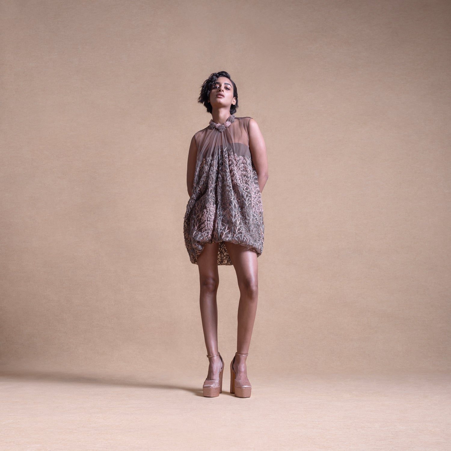 Model in an anti-fit balloon dress made of sheer fabric with textured detailing - artistic high fashion outfit, youngester dress