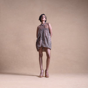 Model in an anti-fit balloon dress made of sheer fabric with textured detailing - artistic high fashion outfit, youngester dress