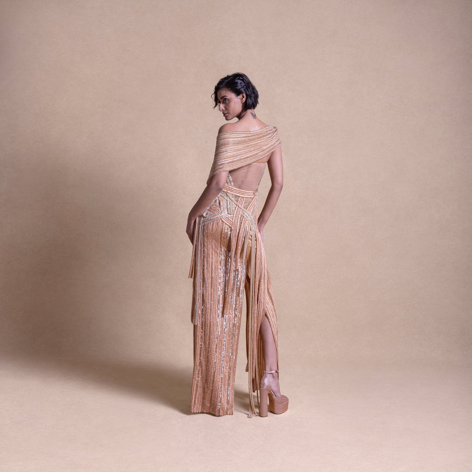 back view of Beige Embellished Panelled Gown with Backless Design and Shoulder Wrap – Elegant Evening Dress, Cocktail Attire