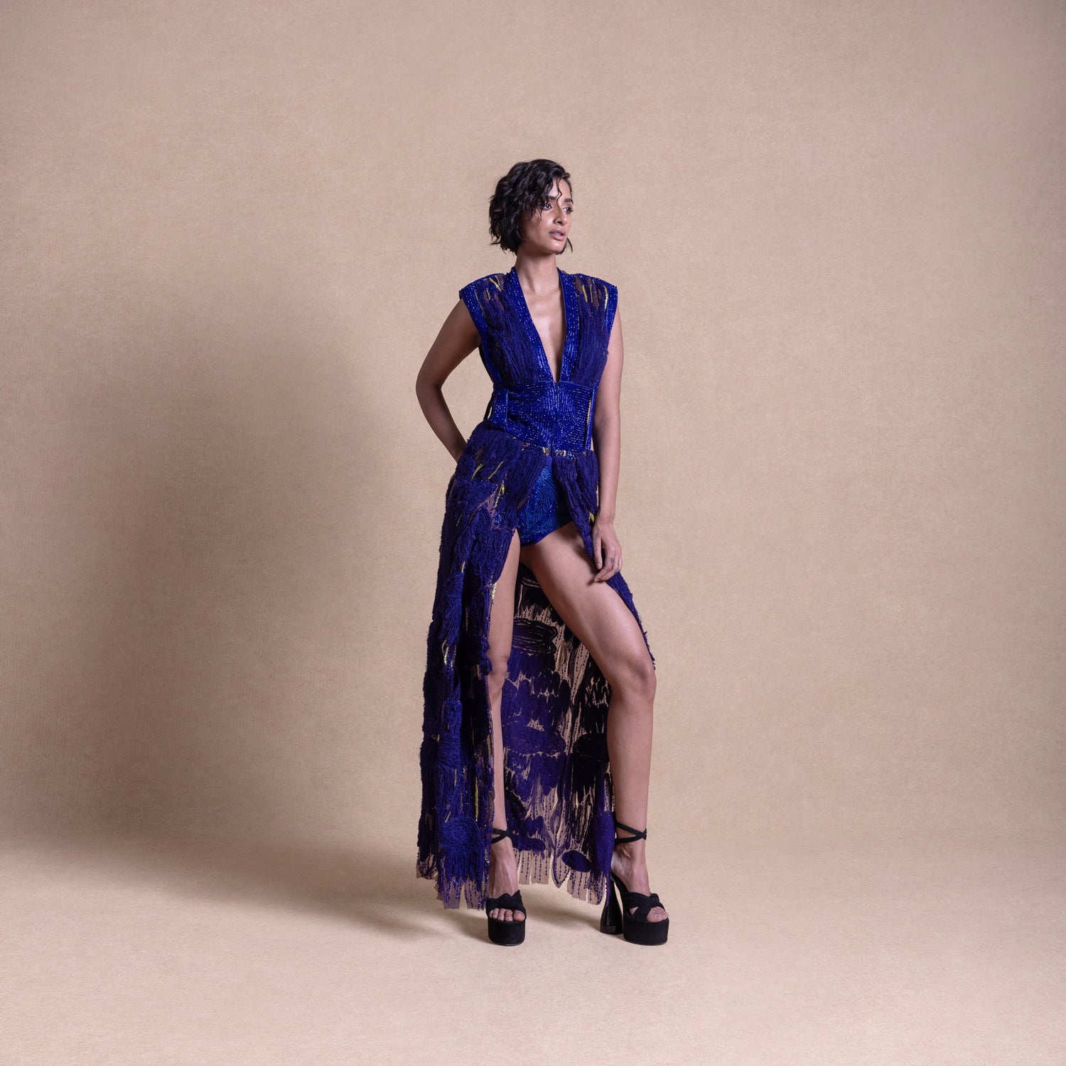 Model in royal blue embellished gown with thigh-high slit and statement shoulders – luxury couture fashion, bold designer outerwear, redcarpet look
