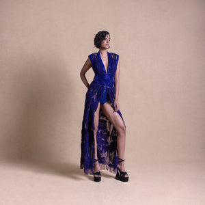 Model in royal blue embellished gown with thigh-high slit and statement shoulders – luxury couture fashion, bold designer outerwear, redcarpet look