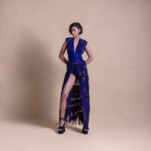 Model in deep blue embellished slit dress with power shoulders and sheer textured panels – statement runway couture, power shoulder fashion, bold couture look