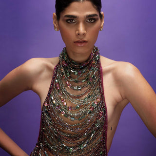 Close-up of Jewel-detailed backless top - bold luxury look, redcarpet jewelled top and skirt.
