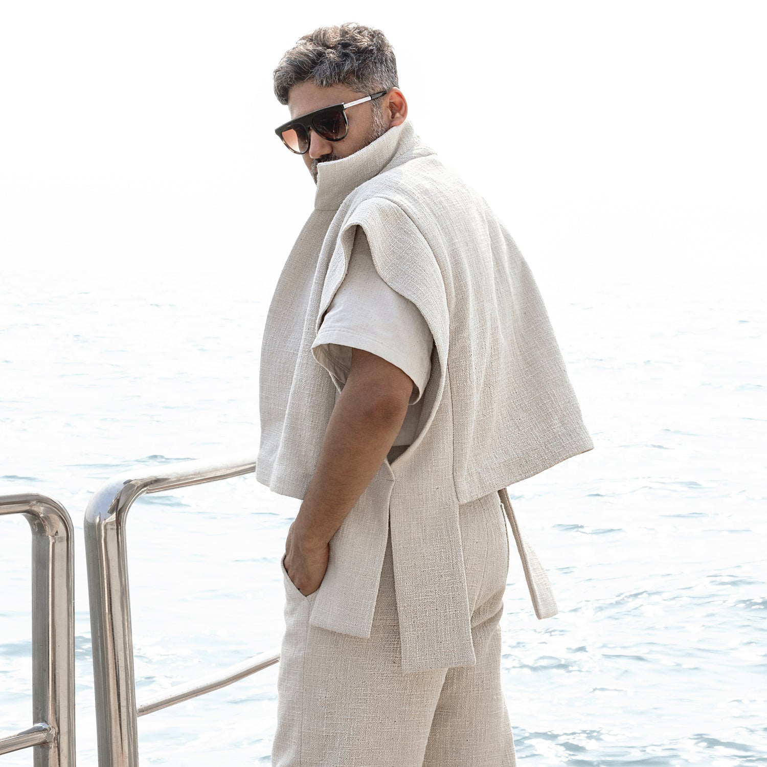 Tailored ivory jacket set with textured shirt and relaxed trousers – refined three-piece look for destination events and understated luxury 