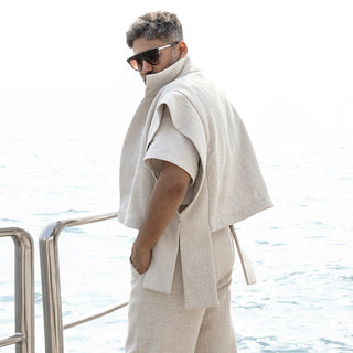 Tailored ivory jacket set with textured shirt and relaxed trousers – refined three-piece look for destination events and understated luxury 