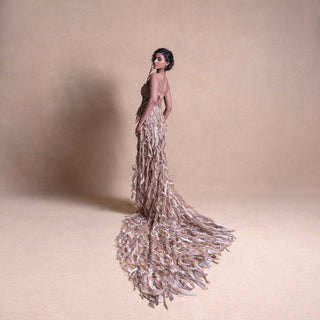 Model in Structured corset with 3D embellished trail skirt, posing with back turned -  high fashion model, redcarpet cocktail gown