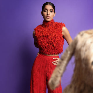 Model in vibrant red Ombre chiffon high-neck top and flared red pants - lightweight modern silhouette, jumpsuit