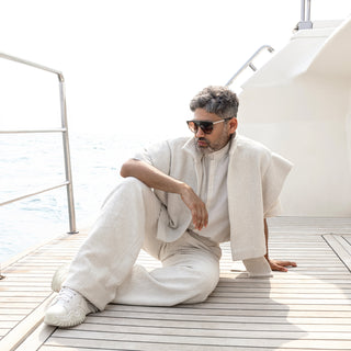 Men's ivory structured jacket with flutted collar shirt and relaxed trousers –Bohemian-inspired men’s summer outfit with relaxed shirt and drapedpants.