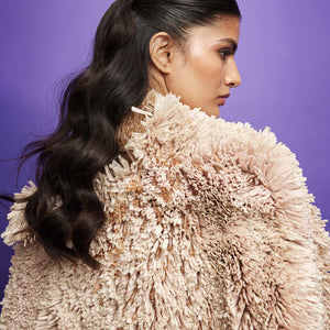 Textured cape with intricate string details over a shimmering gown – avant-garde fashion shoot, textured cape, shimmering gown,