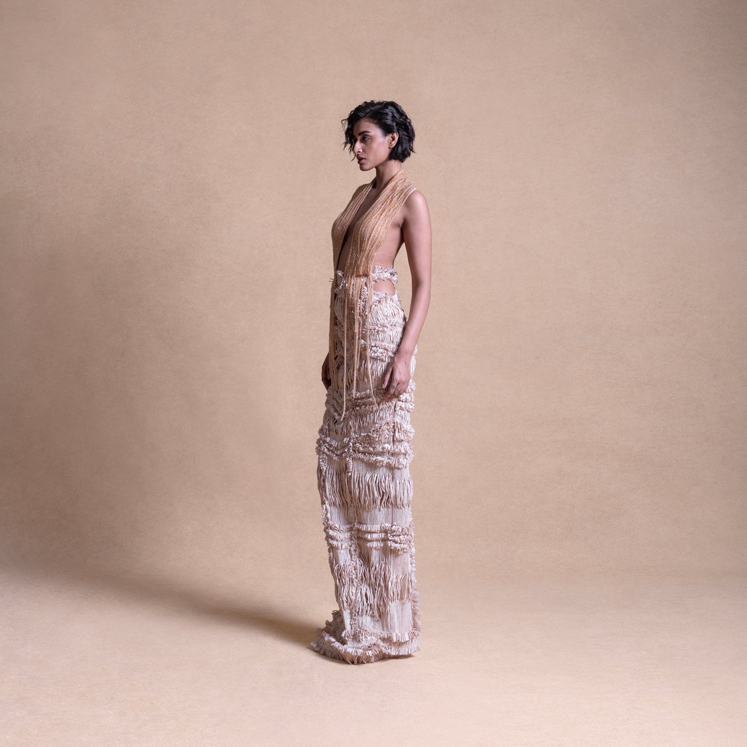 Backless dress with drip string design and side cutouts – contemporary fashion portrait, high fashion