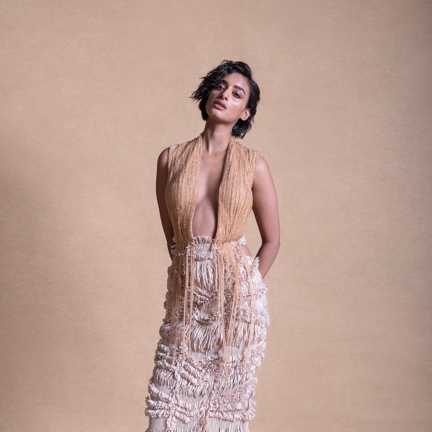 Backless dress with drip string design and deep V-neck – contemporary fashion portrait, backless dress, drip string design