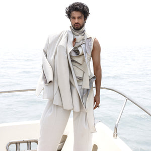 Men's ivory Bandhgala paired with sculpted layered t-shirt and wide-hem pleated trousers for elevated coastal style,  -  carnival party look