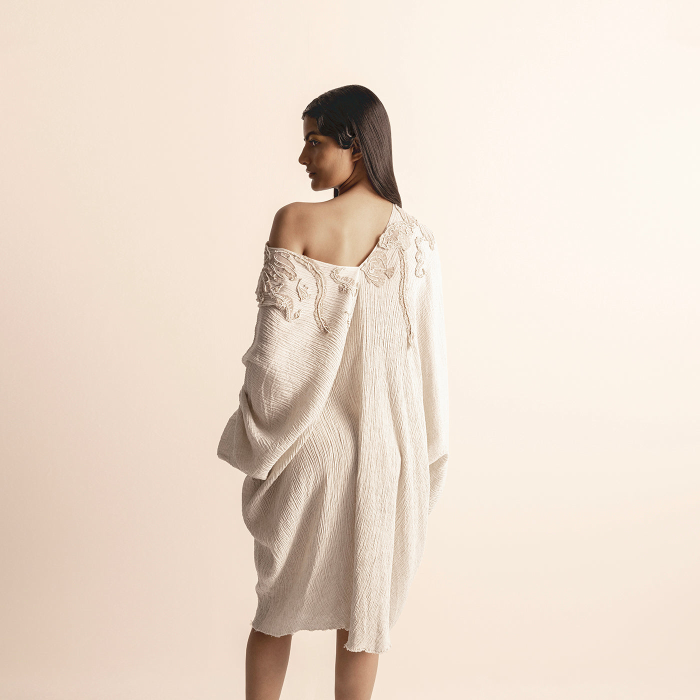 back view of Women's off-shoulder crinkle tunic with back drape and tonal embroidery – sculpted artisanal elegance, crinkle fabric, off-shoulder dress,