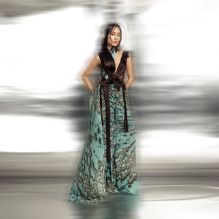 front view of Women's reef printed jumpsuit with sculpted brown bodice and flowing wide-leg drape – modern couture piece with raised neckline
