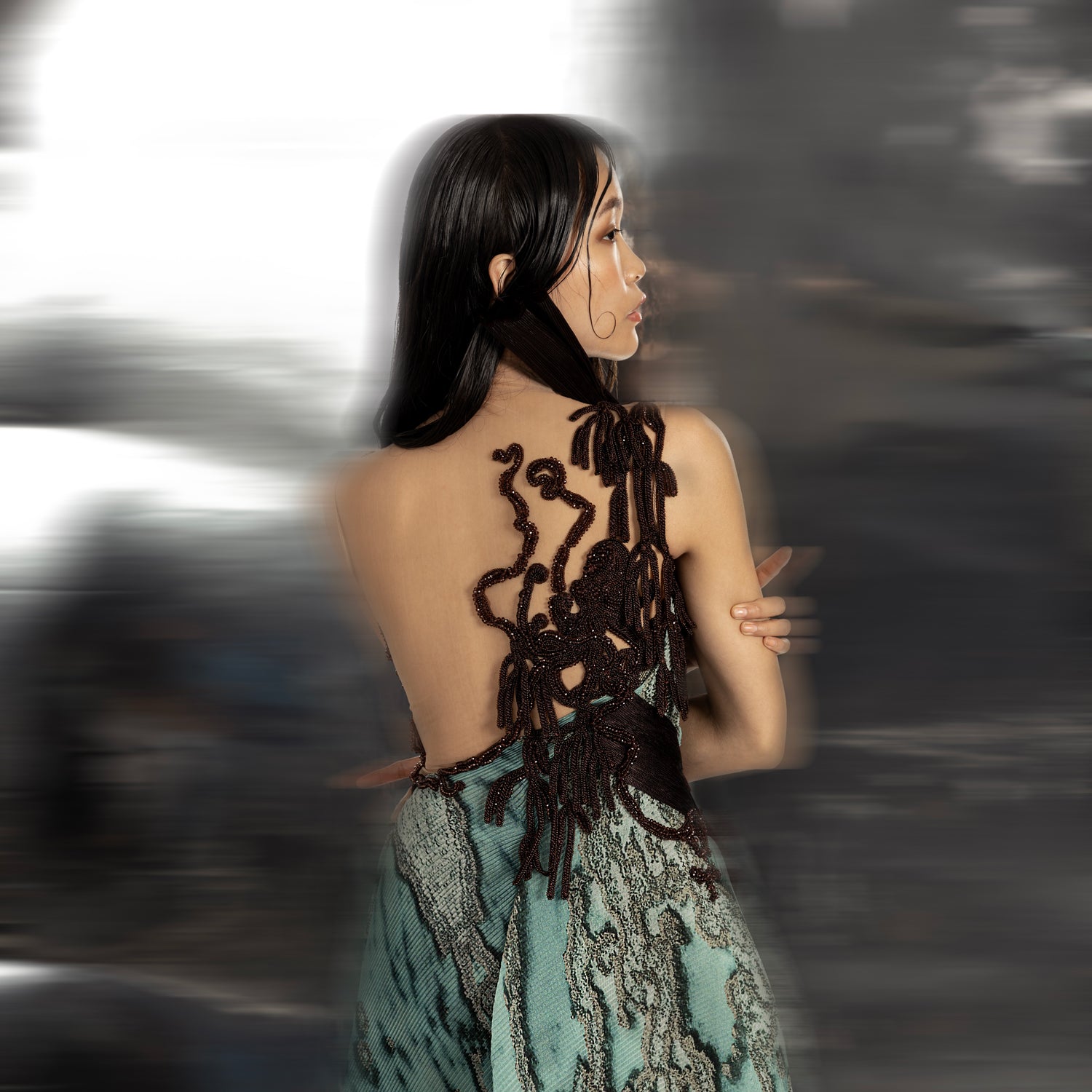 upper back view of Women's reef jumpsuit back view with artistic embroidery and open back detail – sculptural couture ensemble with ocean-inspired texture