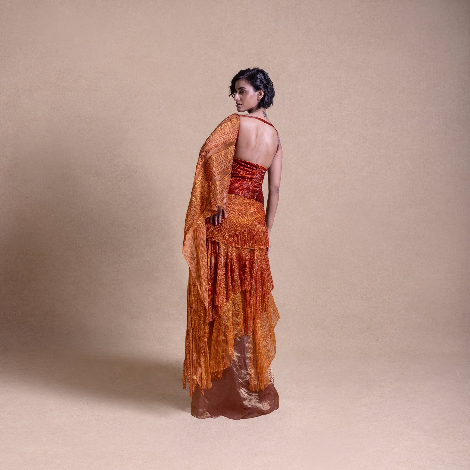 Back view of contemporary pre-draped saree with embellished corset top - Modern Indian design