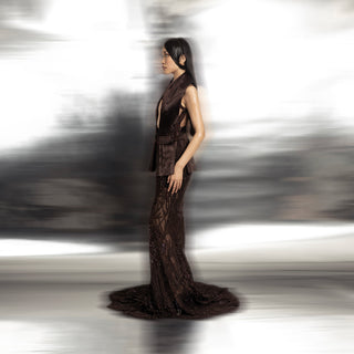 side view of Women's side-profile brown couture gown with textured exaggerated collar and embroidered trail – red carpet designer dress