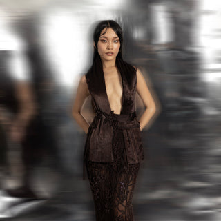 Women's deep brown gown with exaggerated collar and beaded sheer skirt – red carpet couture ensemble
