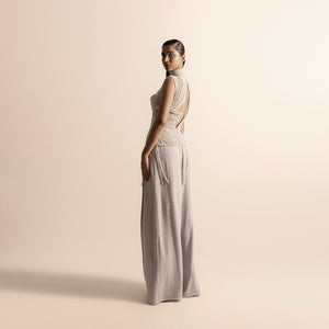 Side-back view of Fluted pearl embellished high-neck corset top with open back and wide-leg quilted trousers – high neck couture, quilted trousers, designer coordinated set