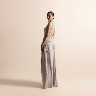 Side-back view of Fluted pearl embellished high-neck corset top with open back and wide-leg quilted trousers – high neck couture, quilted trousers, designer coordinated set