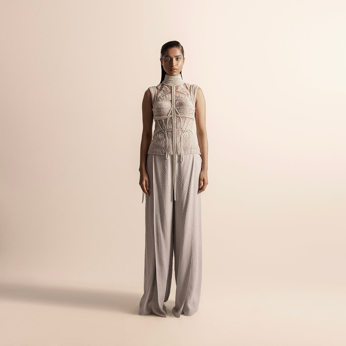 Front view of Fluted  high collar pearl embellished sheer corset top with wide-leg quilted trousers – high collar blouse, sheer detailing, wide-leg trousers, designer co-ord set