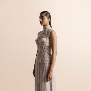 Side view of Fluted pearl embellished high collar top with sheer paneling and quilted chiffon trousers –  high collar blouse, sheer couture, chiffon trousers, designer coordinated look