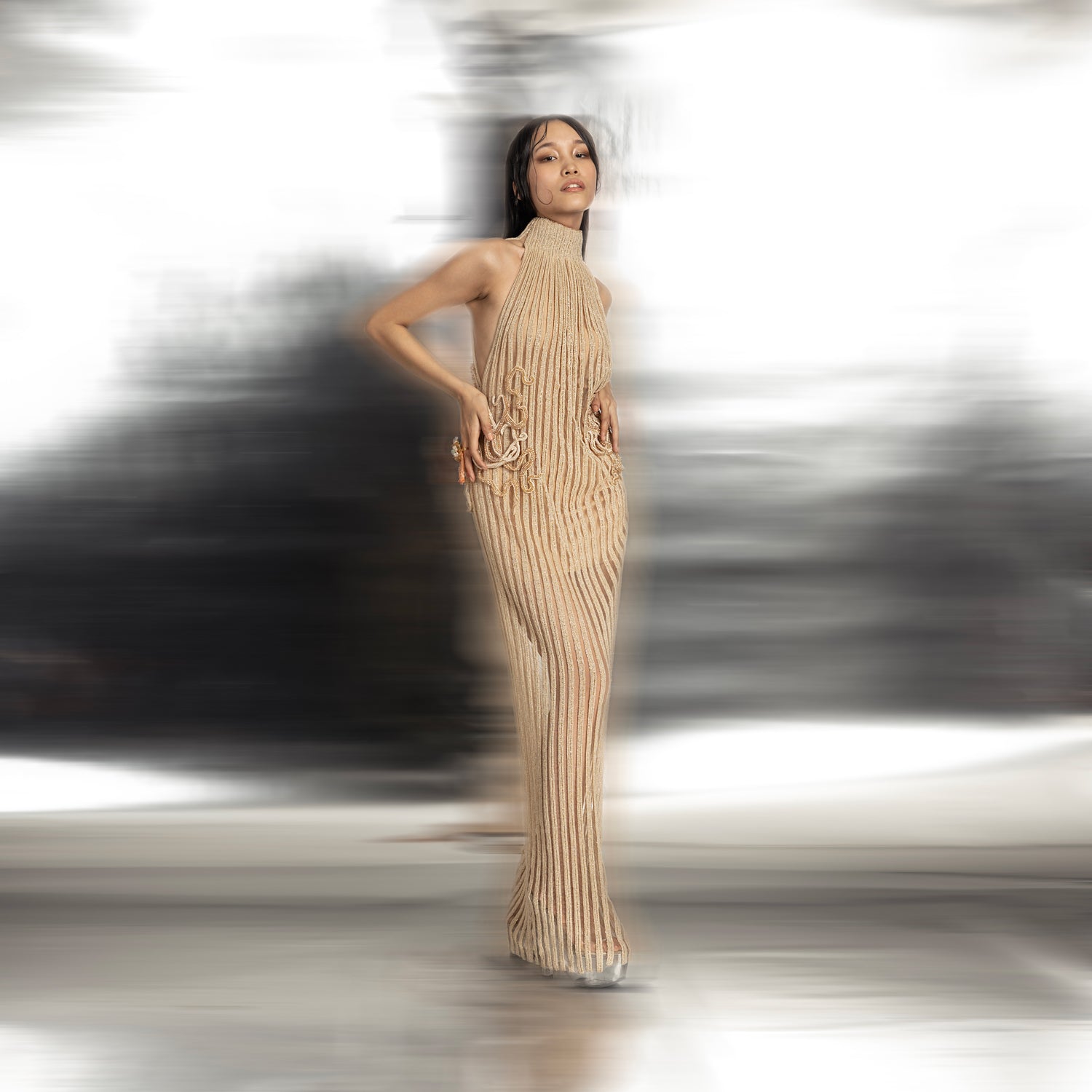 full length of Women's incut sleeve gown with high collar and vertical pleated texture – sleek modern silhouette for evening wear