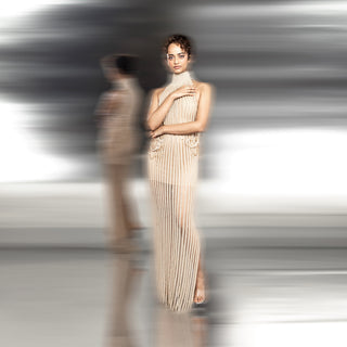 full front length of high-neck pleated shift gown with side embroidery and sheer texture – minimalist evening couture look