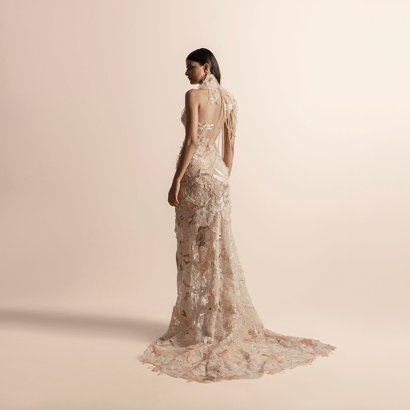 Back view of high halter neck embellished gown with long trail – showstopper evening dress, halter neck back, embellished dress, long trail dress