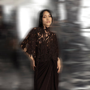 Women's sheer black high-neck cape with reef-inspired 3D embroidery over draped chiffon saree – modern couture layering