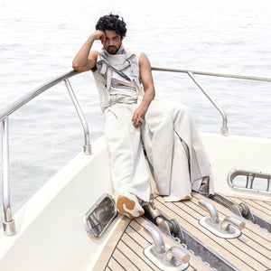 Ivory bandhgala set with layered inner tee and relaxed pleated pants – modern festive outfit with structured ease