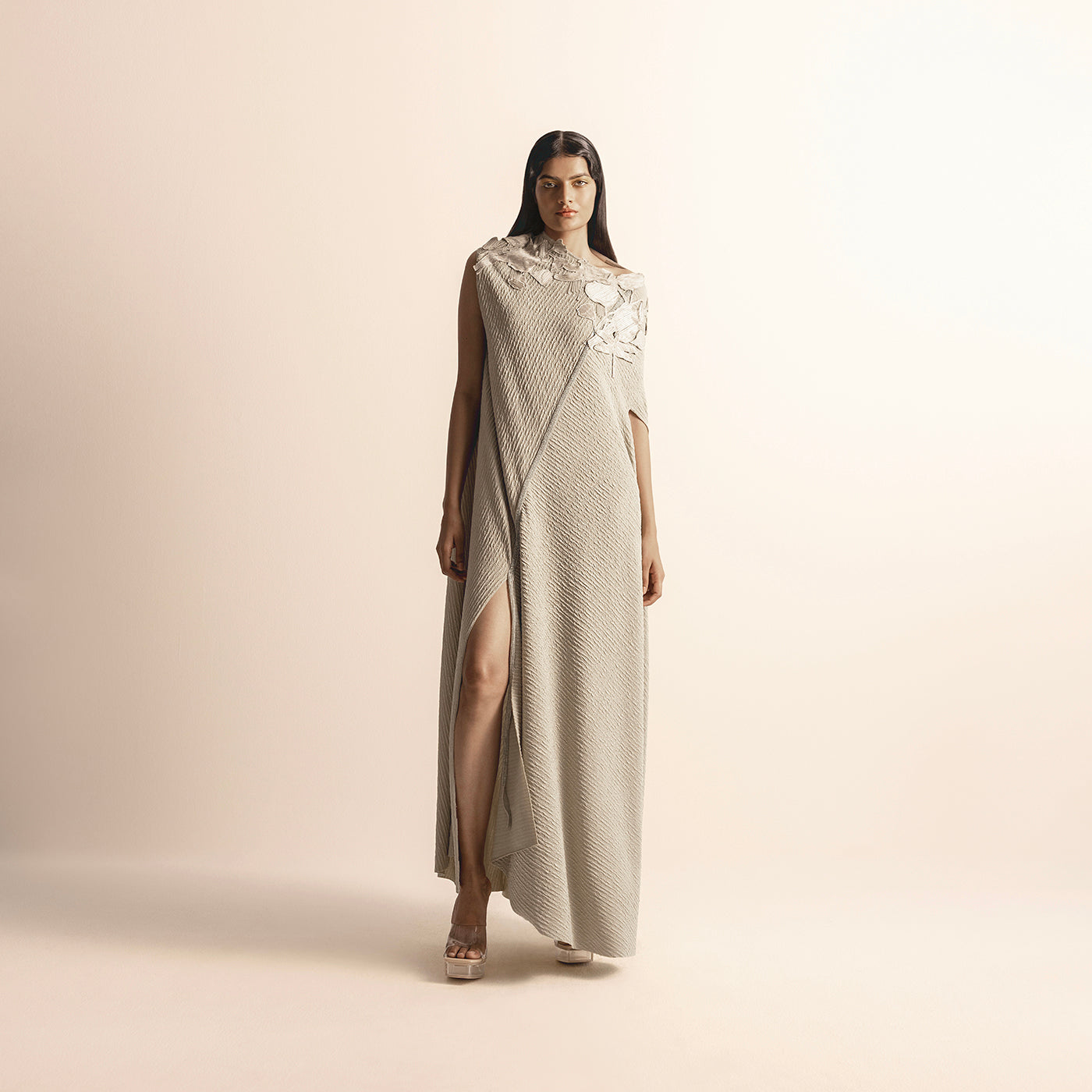 full length of Women's asymmetrical knit gown with floral yarn detailing and thigh-high slit –  asymmetrical knit gown, floral yarn detailing, thigh slit dress, evening knitwear,