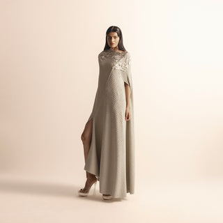 side view of Women's asymmetric knit evening dress with sculpted floral yarn accents and side slit – elevated draped silhouette, asymmetric knit dress, evening gown