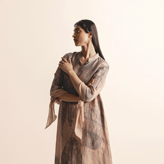 Close-up of Nadru print A-line dress with tie-up sleeve detail – soft textured fabric with poetic feminine finish