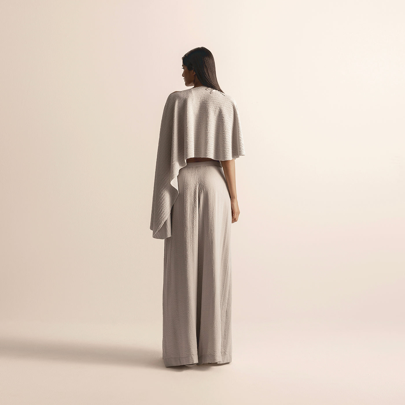 back view of Women's knit crop top with extended drape and textured quilted pants - quilted palazzo pants, Indo-western co-ord, textured knitwear