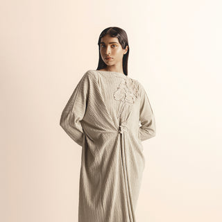 Women's beige knit tunic dress with gathered drape and handcrafted yarn floral motifs – sculptural artisanal silhouette, knit tunic dress, yarn floral motif, handcrafted detailing,
