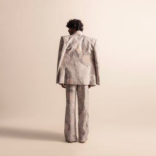Back view of Nadru printed men's suit with wide-leg trousers and sharp-shouldered blazer, statement blazer, artistic tailoring