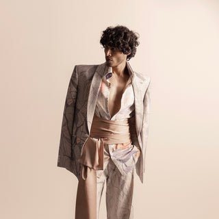 Nadru printed suit with draped blazer and soft pink sash – modern artistic menswear, men's fashion sash, artistic print, bold menswear style